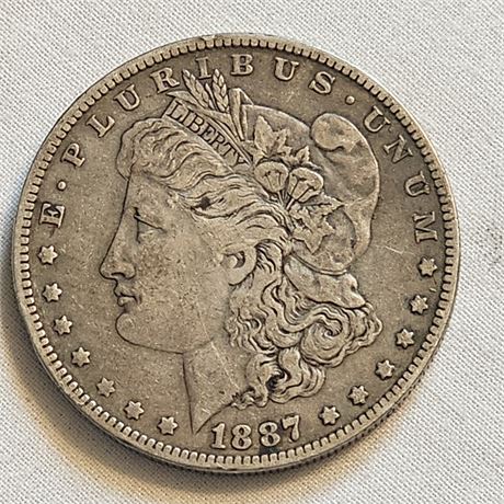 1887 O  Morgan Silver Dollar.