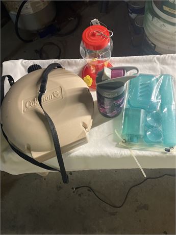 Coleman water jug, a Contigo travel mug, a hummingbird feeder