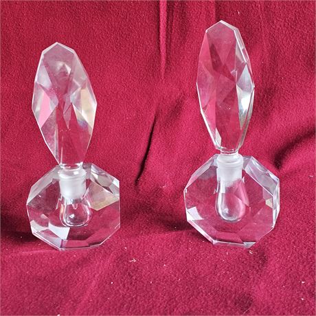 vintage hand-cut crystal perfume bottle with an octagonal base and a feather-sha