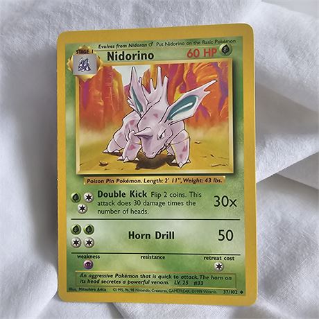 Nidorino Pokémon trading card,