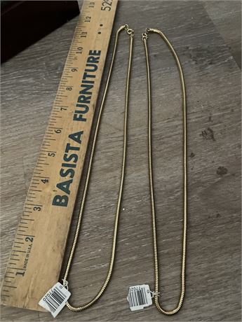 Gold-tone snake-style chain necklaces.