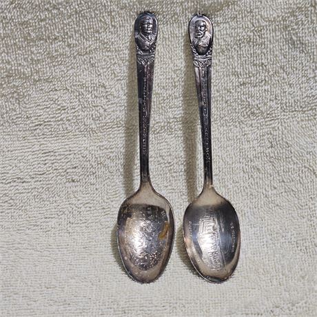 Two vintage silver-plated souvenir spoons, likely from a set commemorating U.S.
