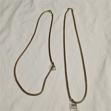 Two two snake chain necklaces.
