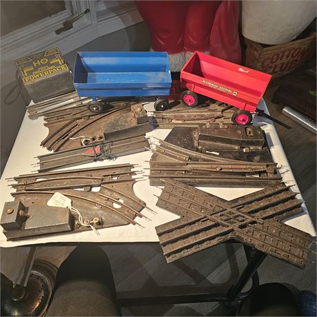 Collection of vintage model train tracks and accessories,