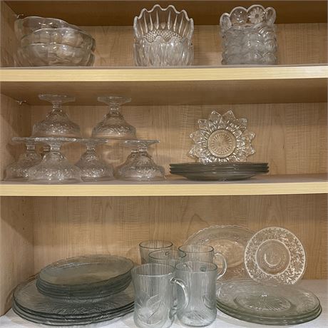 Cabinet of Clear Glass Serving Pieces with Plates, Mugs, Dessert Cups and More