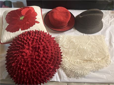 2 hats, a doily, 2 decor pillows