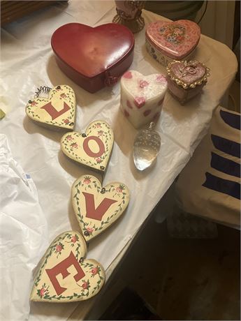Collection of heart-shaped trinket boxes and other decorative items.
