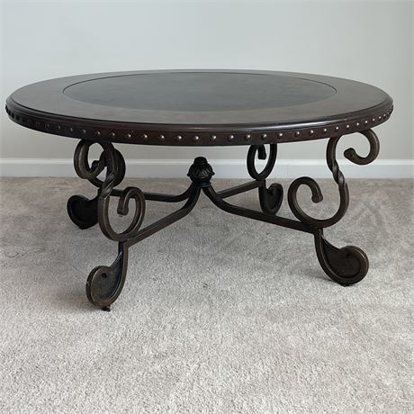 Joniedell Round Cocktail Table with Steel Base by Ashley Furniture