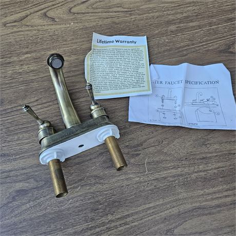 Pegasus two-handle  bathroom faucet in an antique brass or bronze finis
