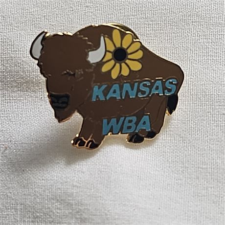 Pin featuring a buffalo and a sunflower, with the words "KANSAS WBA" on it.