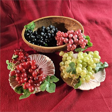 Collection of artificial grape clusters in various colors, including red, black,