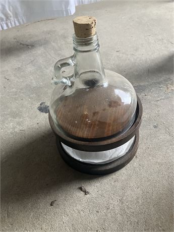 Folk art gallon jug cut into three sections with wood dividers,