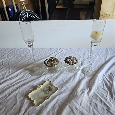 Set of decorative glass items, including two tall, stemmed candle holders and t