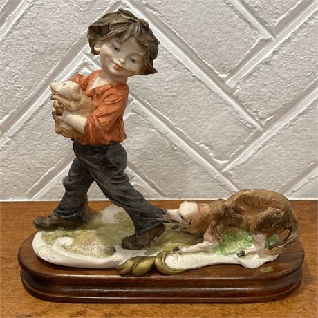 Capodimonte Porcelain Figurine of Boy with Dogs on Wooden Base