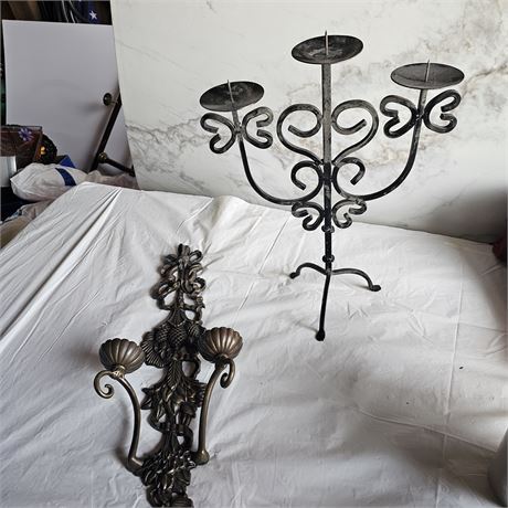 wrought iron candelabras and a wall sconce.