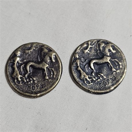 Two replicas of ancient Roman coins,