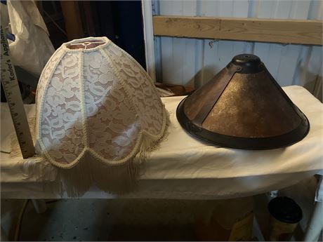 Two different styles of lampshades, one is a fringed lace Victorian-style