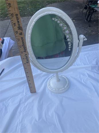 vintage-style, oval vanity mirror. It features a swivel design,