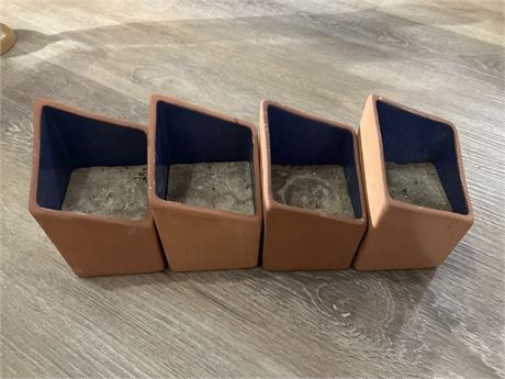 Set of four candles - pottery material