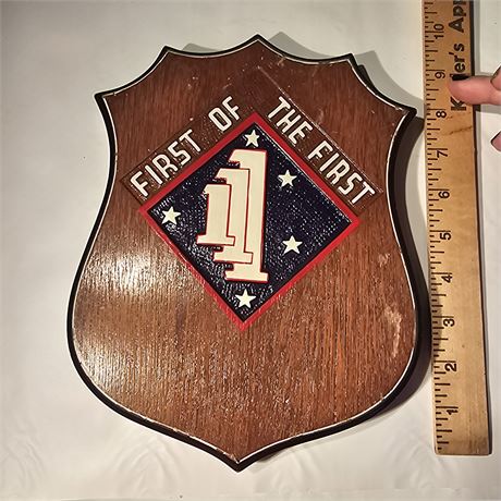 Plaque featuring the insignia of the 1st Battalion, 1st Marines (1/1