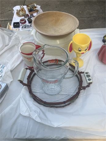 Two bowls one decorative strainer coke pitcher two glasses