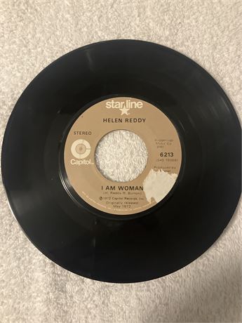 45 RPM vinyl record of Helen Reddy's song "I Am Woman," released on the Capitol