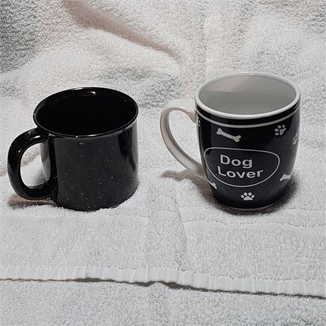 Two mugs, one of which is a "Dog Lover" themed coffee or tea mug.