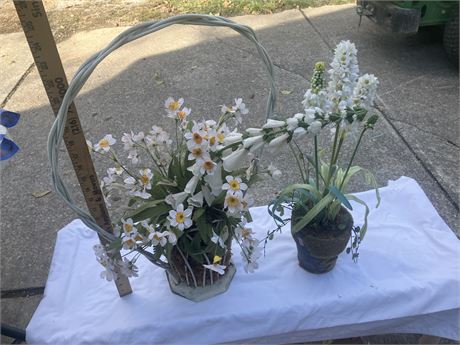 pair of potted arrangements featuring artificial flowers that resemble varietie