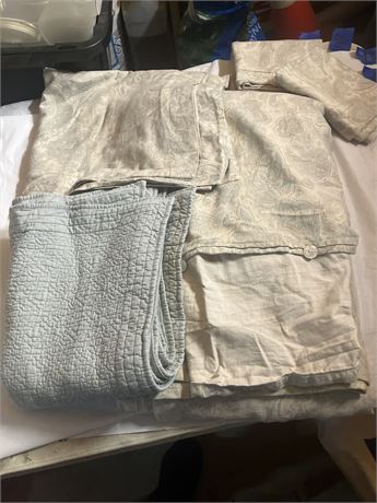 One sheet set including 2 pillowcases and one smaller blue blanket