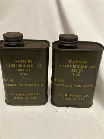 Two cans of military-issue rifle bore cleaner,