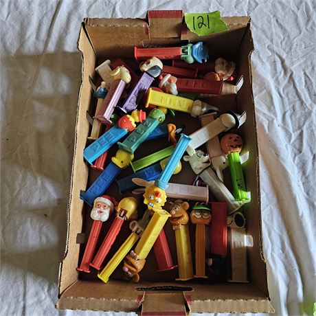 Collection of various vintage PEZ dispensers.