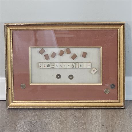 Framed collection of vintage Mahjong tiles and Chinese coins, likely arranged