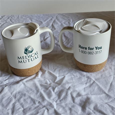 Two coffee mugs branded with the logo for Medical Mutual, an Ohio-based health