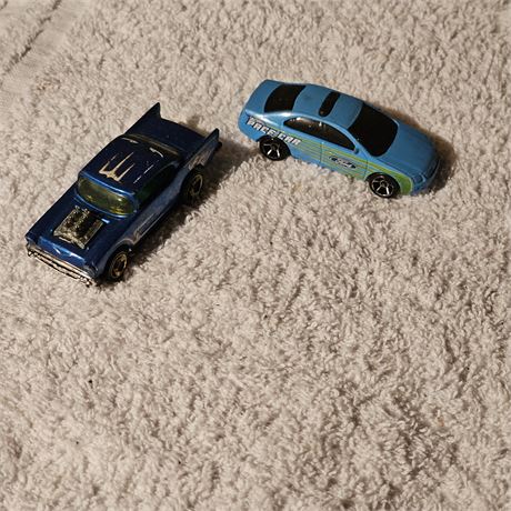 1976 Hot Wheels '57 Chevy diecast car and Ford Fusion model
