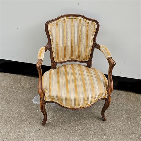 Lovely upholstered french carved arm chair