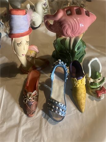 vintage ceramic figurines, including a lady head vase and a fish-shaped planter.
