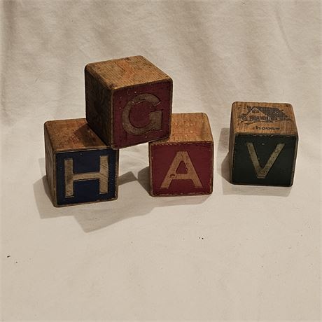 Four vintage wooden alphabet blocks