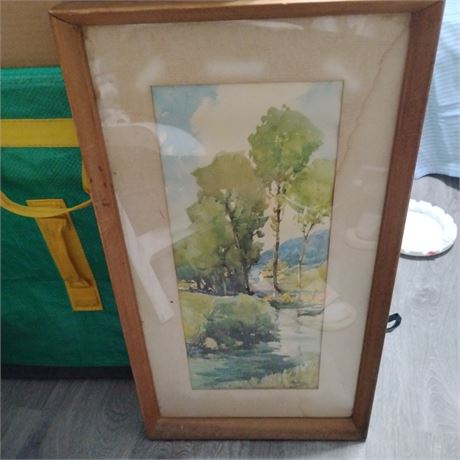 Vintage watercolor painting in a wooden frame.