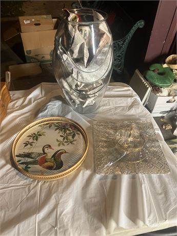 Several decorative items, including a large glass vase