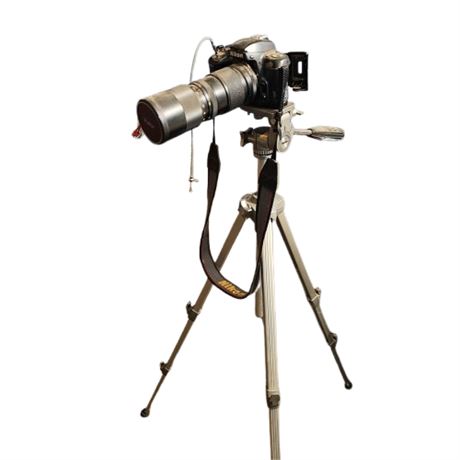 35 mm Nikon N6006 Camera with stand and telephoto lens