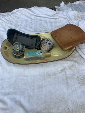 vintage and antique items on a tray, including a wooden box, a small snow globe