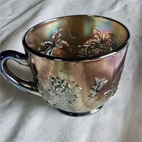 Indiana Carnival Glass Punch Cup in the "Princess Blue" or "Harvest" pattern.