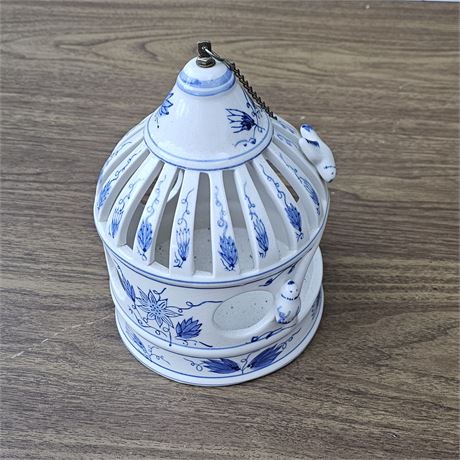 ceramic birdcage lantern or a hanging bird feeder, featuring a blue-and-white ch