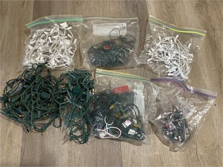 Assorted Christmas lights, including strands of green and white lights,