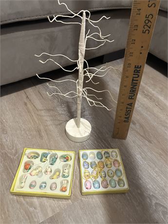 Tabletop Easter tree with a collection of small, hand-painted ornaments.