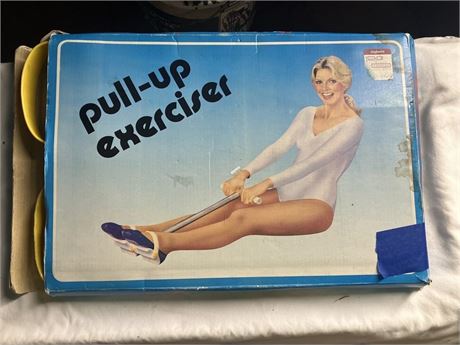 vintage "pull-up exerciser," also known as a rowing or spring-action exerciser.