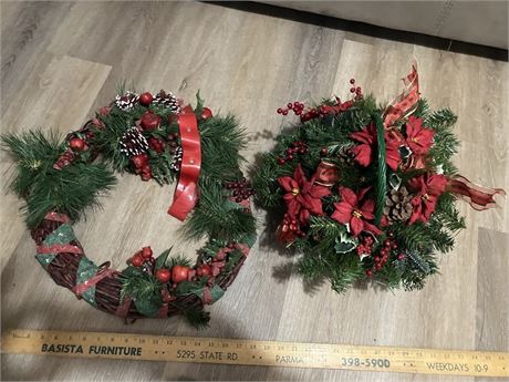 two artificial Christmas wreaths.