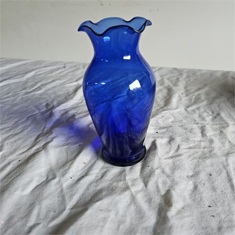 Cobalt blue glass vase with a ruffled edge
