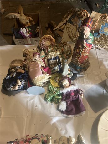 Collection of dolls, many of which appear to be antique or vintage porcelain dol