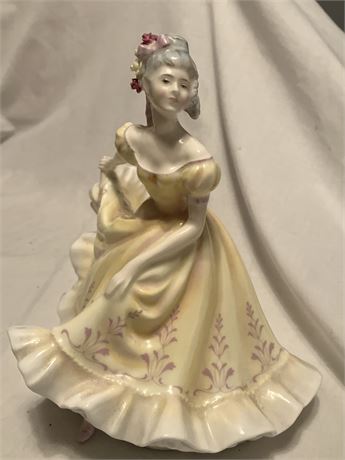 Royal Doulton "Ninette" figurine. It is a hand-painted bone china figurine of a
